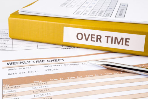 Overtime paperwork laid out on table