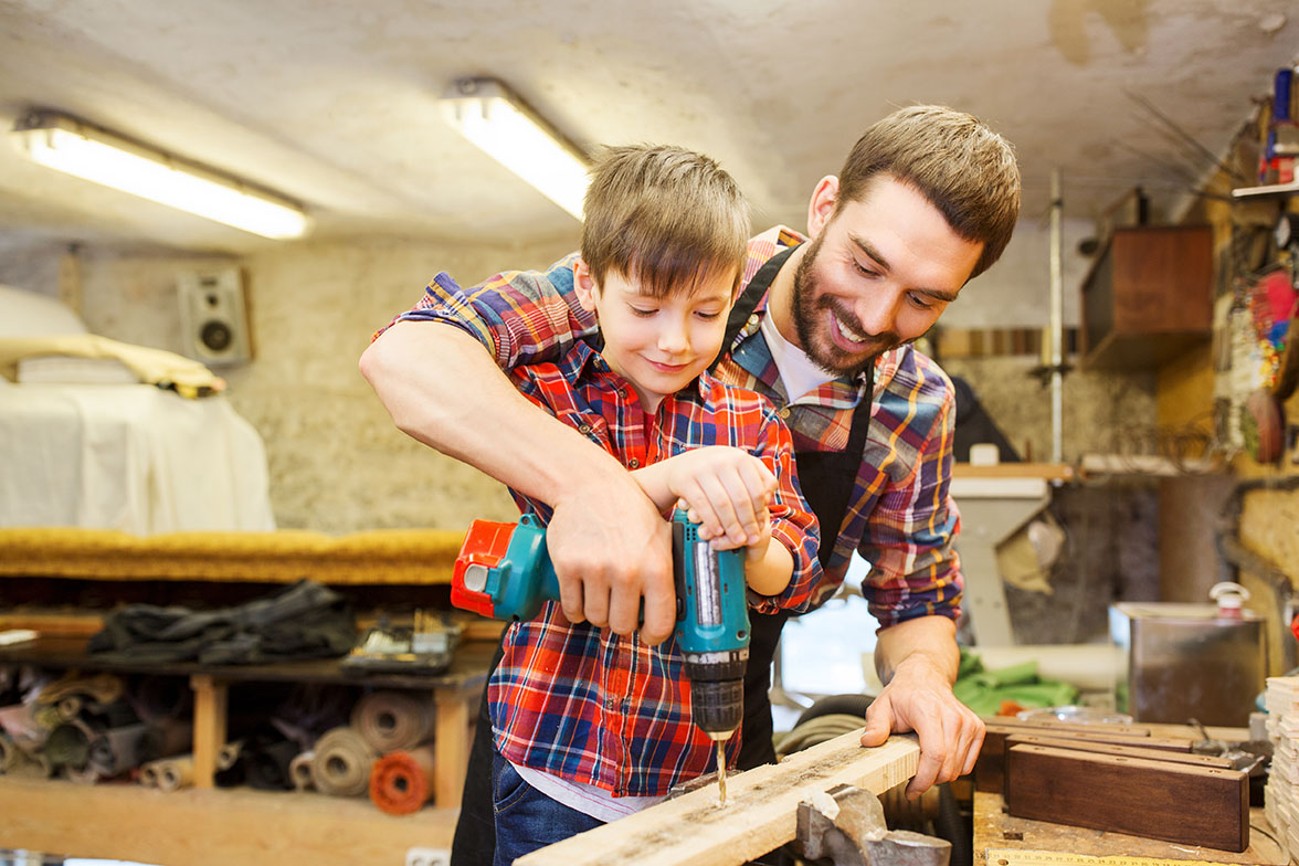 Man and son working in a woodshop
